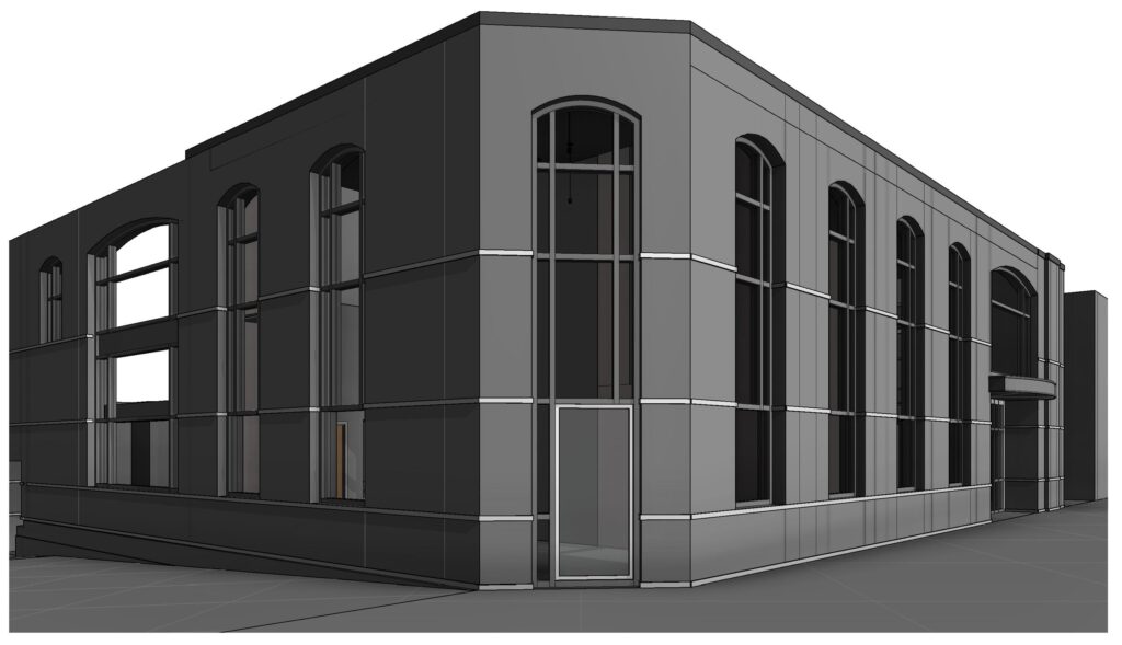 An exterior corner view of the two-story building, with tall arched windows above a solid base on both street elevations.