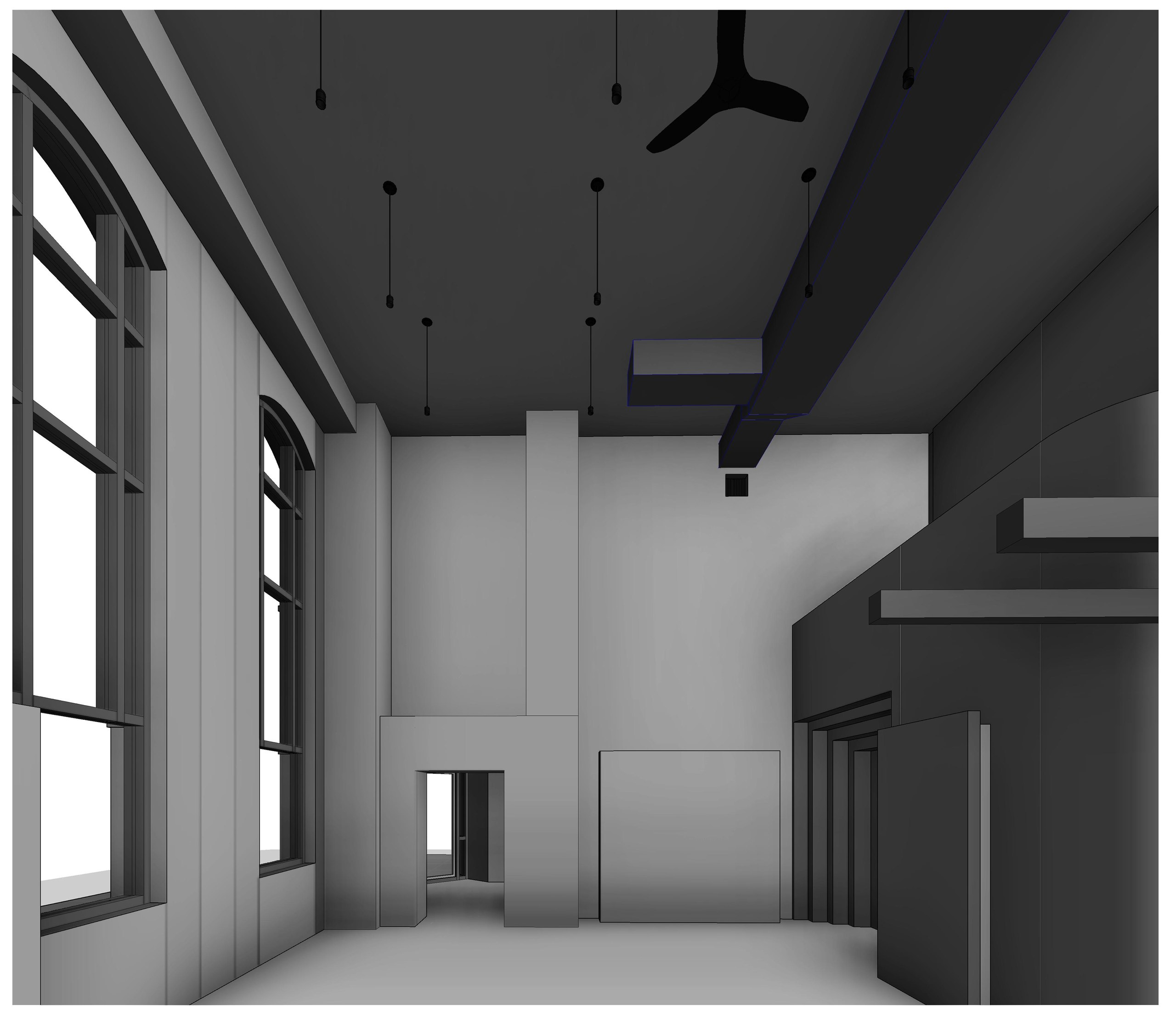 A room with tall arched windows along one wall, exposed beams overhead and a ceiling fan.