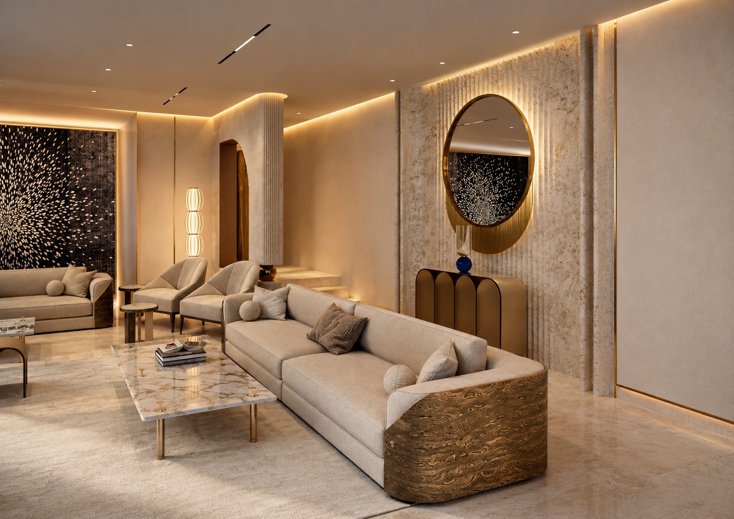 A seating group with a round brass-framed mirror on a travertine wall, a sofa with a figured bronze end panel and a marble coffee table.